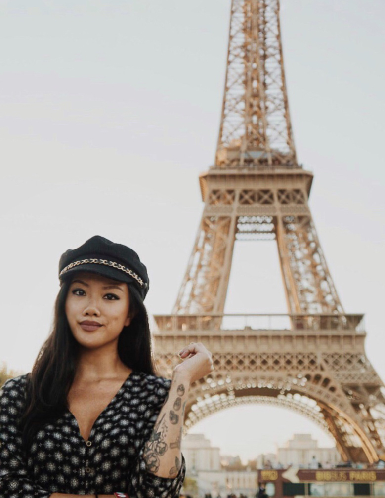 an American girl at the Eiffel Tower during the day