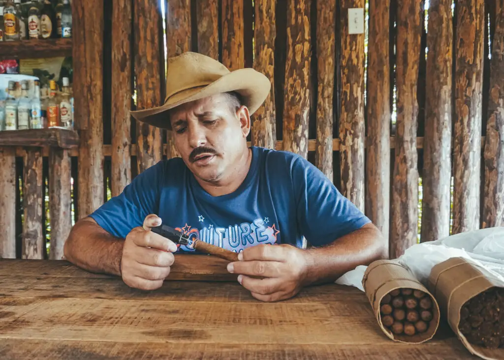 a tobacco farmer rolls a cigar in Vinales Valley 