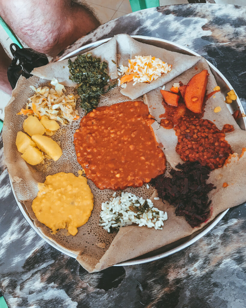 a colorful Ethiopian breakfast of injera and vegetable dishes