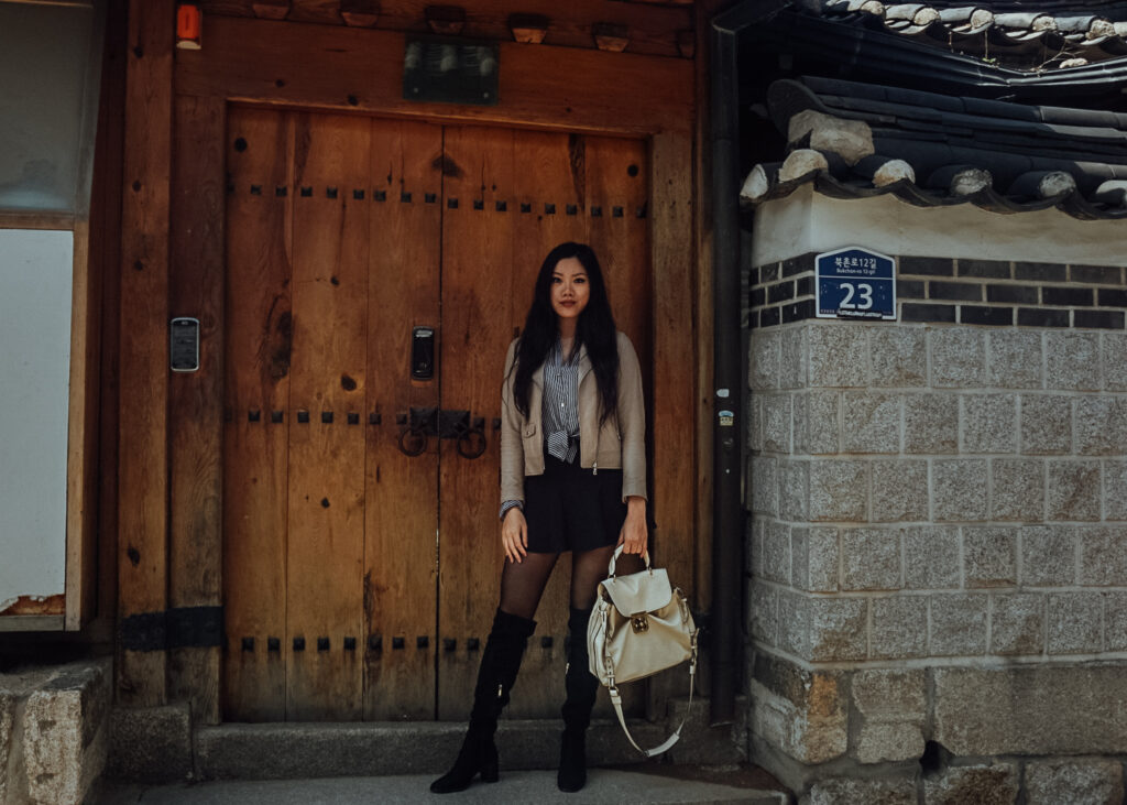 A girl traveling with designer clothing in south korea