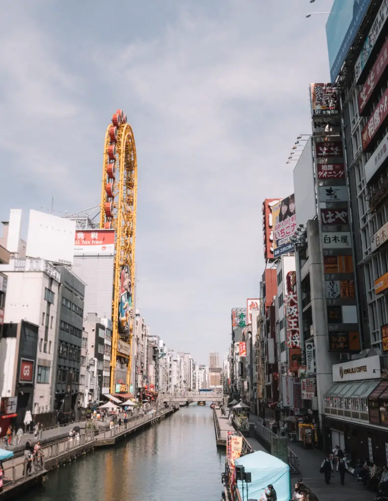 ferris wheel and river in dotonburi