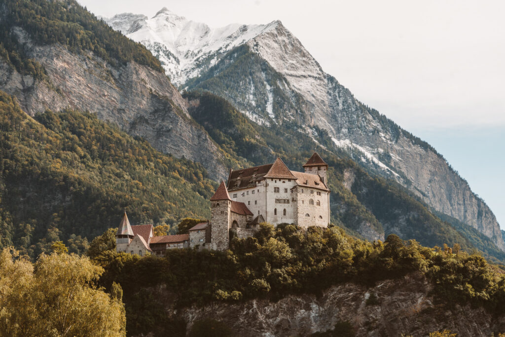 beautiful castle in Liechtenstein with the mountains in the bckground
