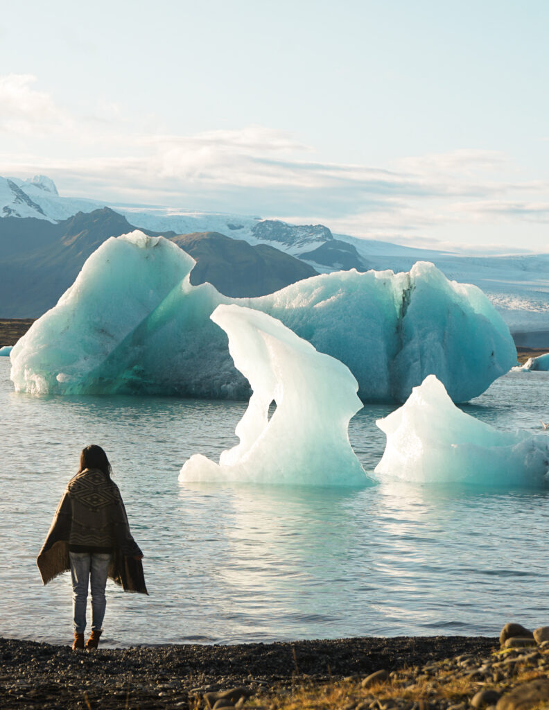 a girl traveling solo at the glacier lagoon in iceland