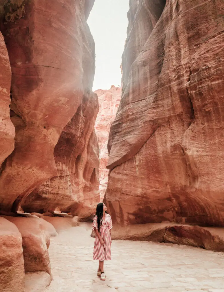 a girl at al siq in petra on the 3rd day during her 1 week in Jordan