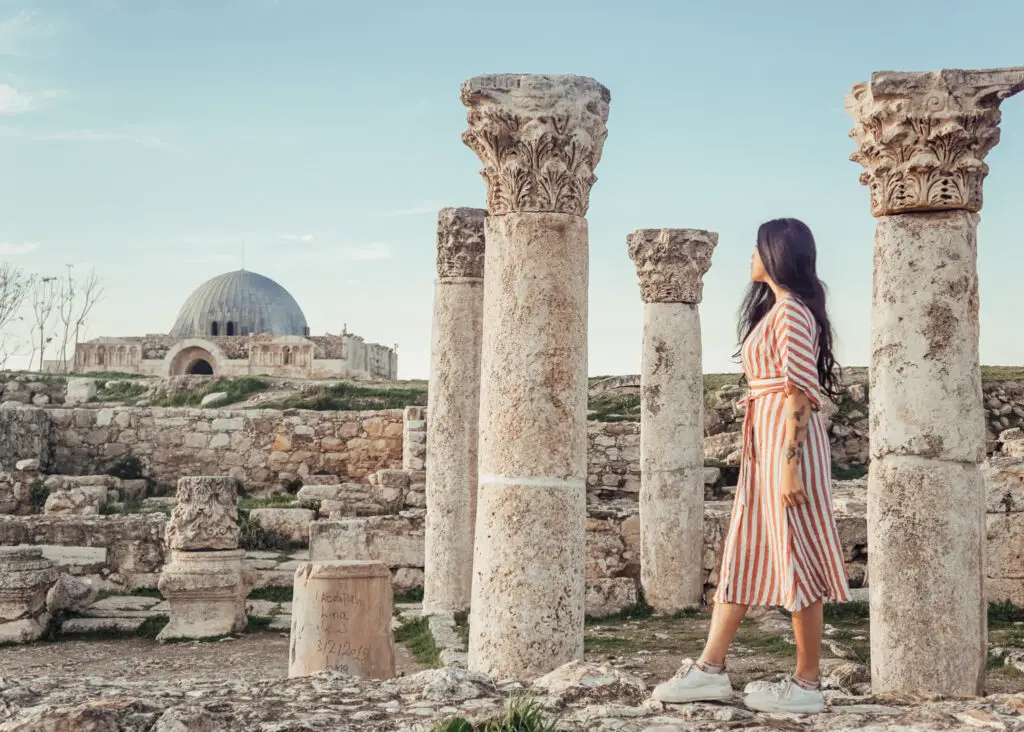 a girl and a byzantine church at the citadel in amman in jordan