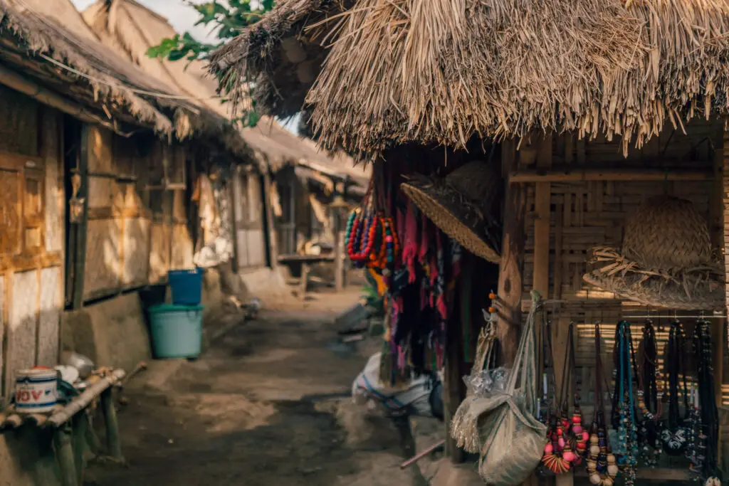 a traditional village of thatched grass roofed huts in lombok