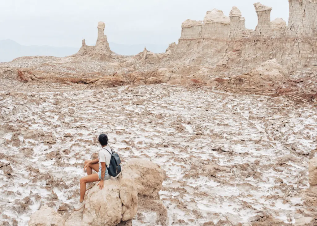 a girl and some white rocks at danakil ethiopia