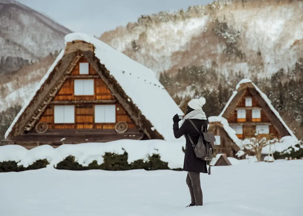 girl in the snow at shirakawa-go in winter