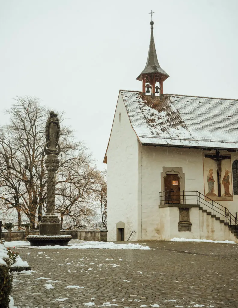 a chapel in rapperswil covered in snow on a winter day 