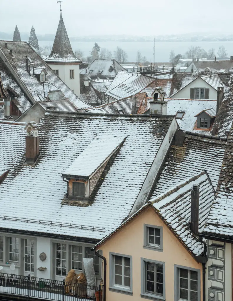 views of the snow covered roofs of the old town in rapperswil from the castle of rapperswil in winter