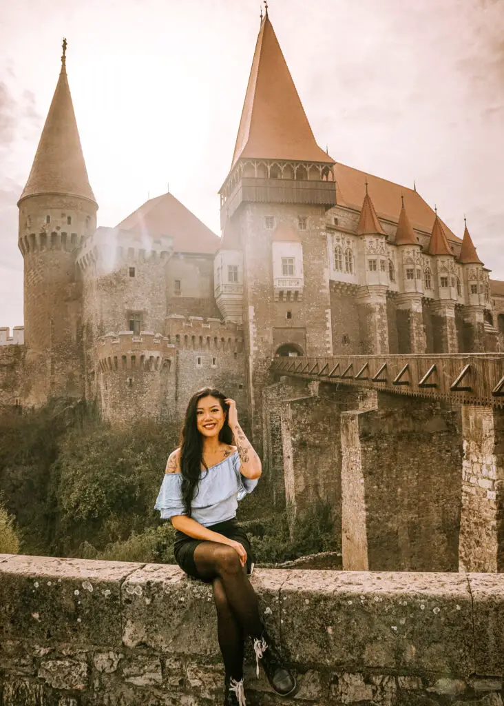 girl in front of corvin castle in romania