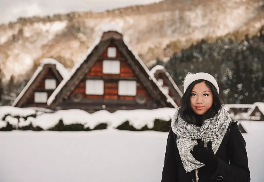 a girl in the snow in Shirakawa-go in Winter