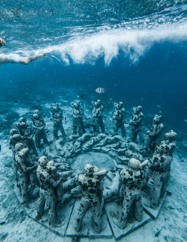 underwater statues of men and women that form a circle located on gili meno, an island close to lombok