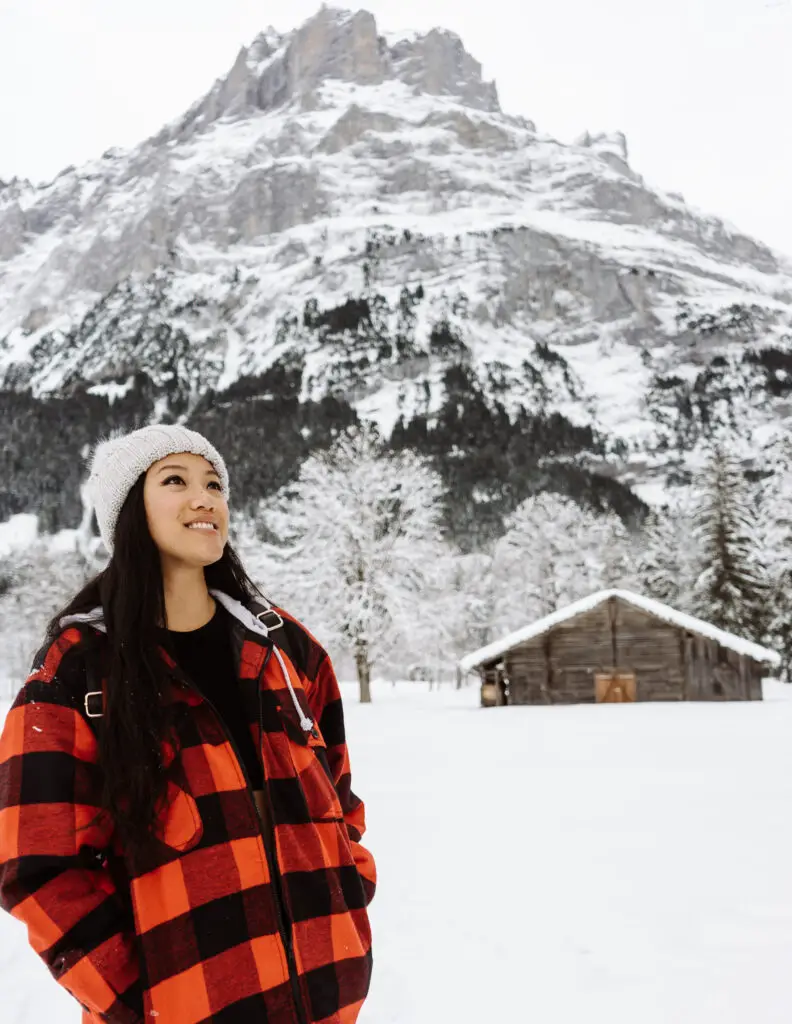 a girl visiting grindelwald switzerland in winter