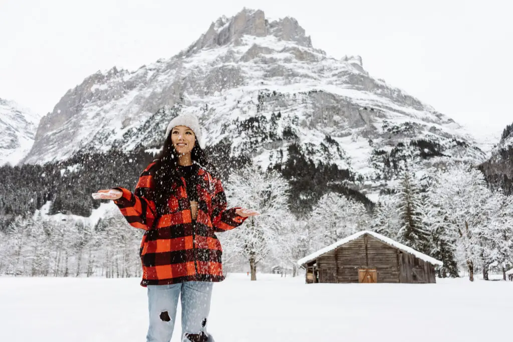 a girl visiting grindelwald switzerland in winter