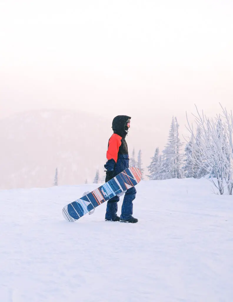 a man with a snowboard in the snow 