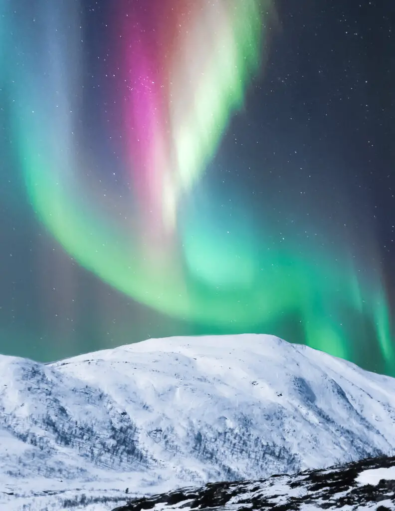 color northern lights in winter in iceland