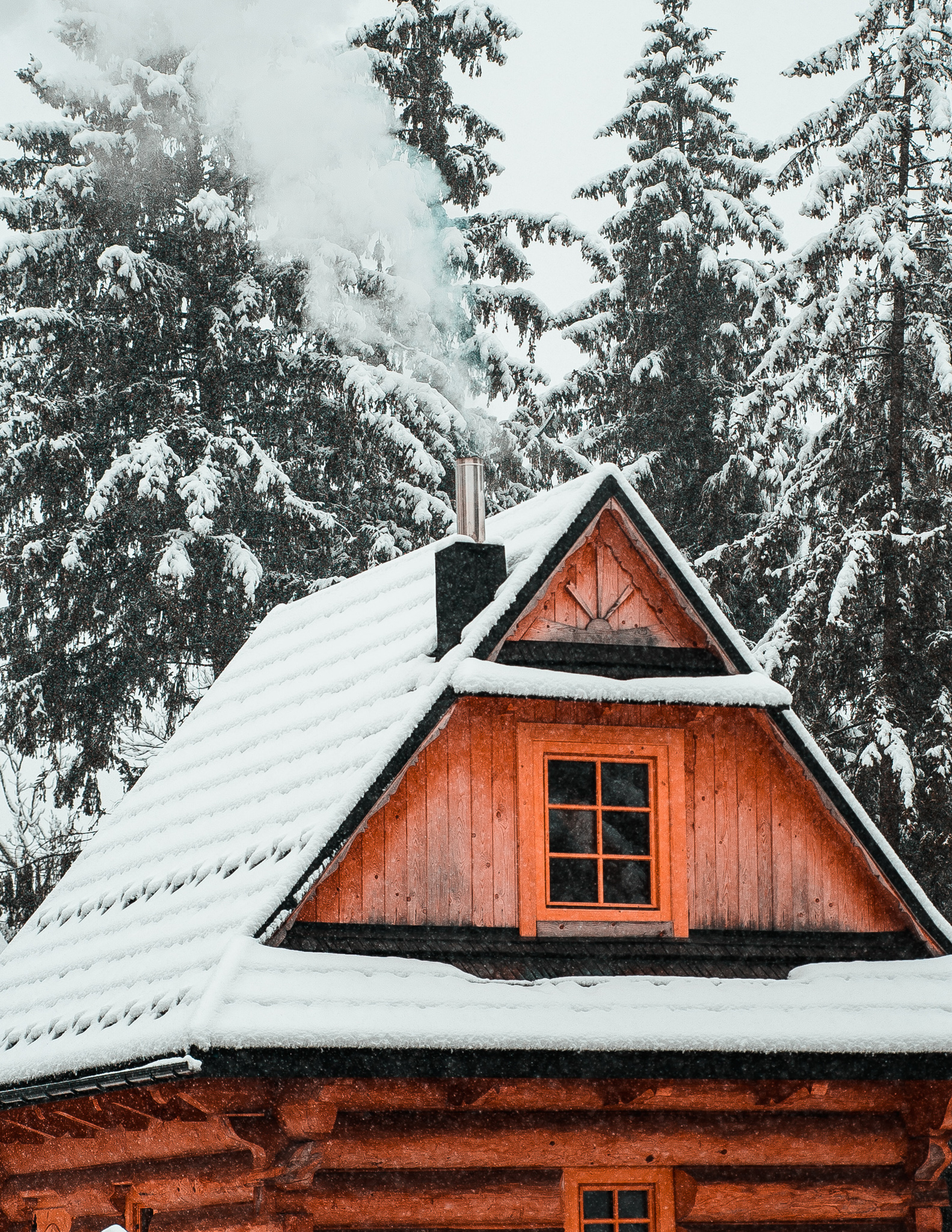 a wooden mountain cabin in poland in winter