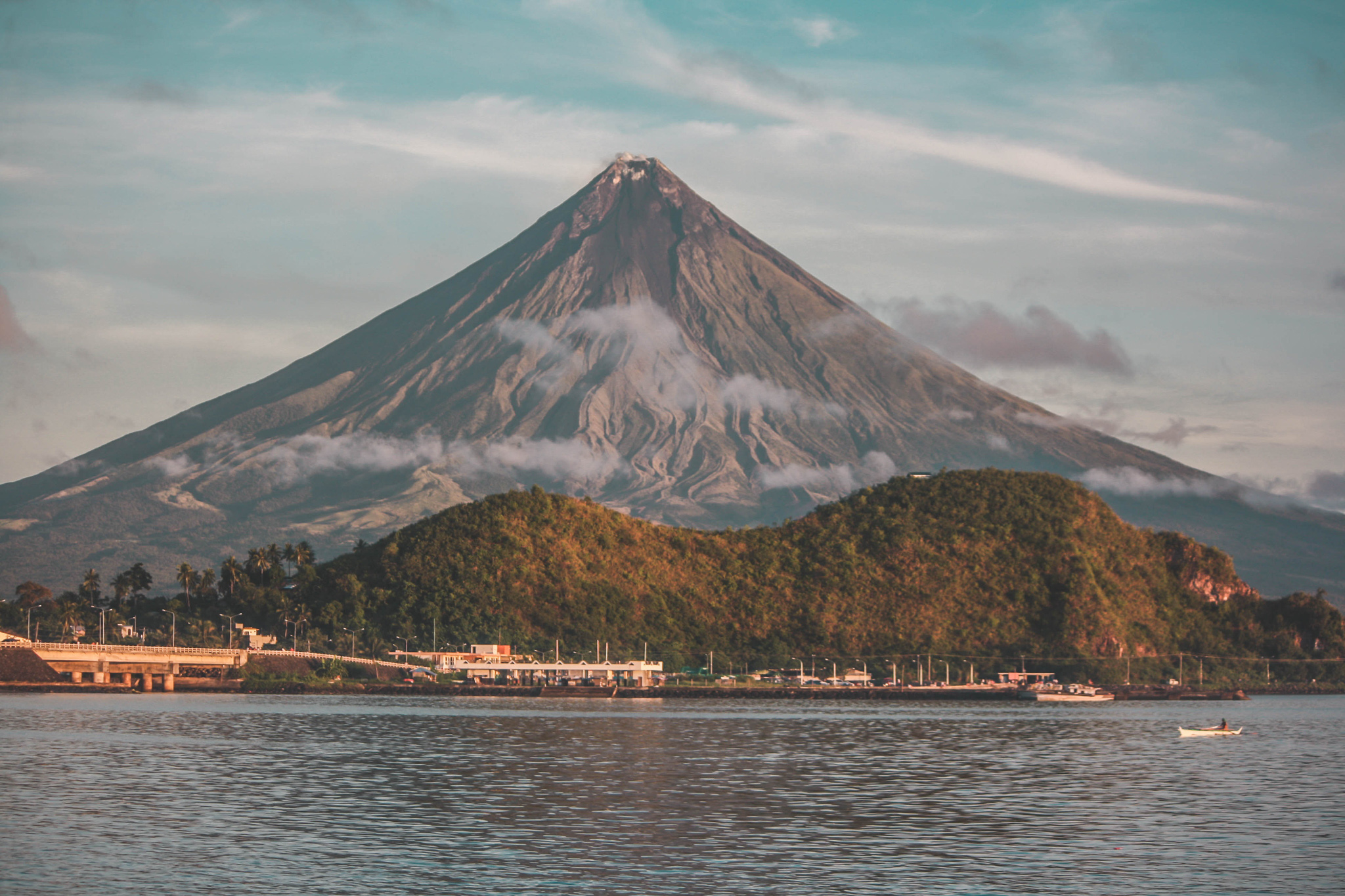 a view of mount mayon over a lake in the philippines