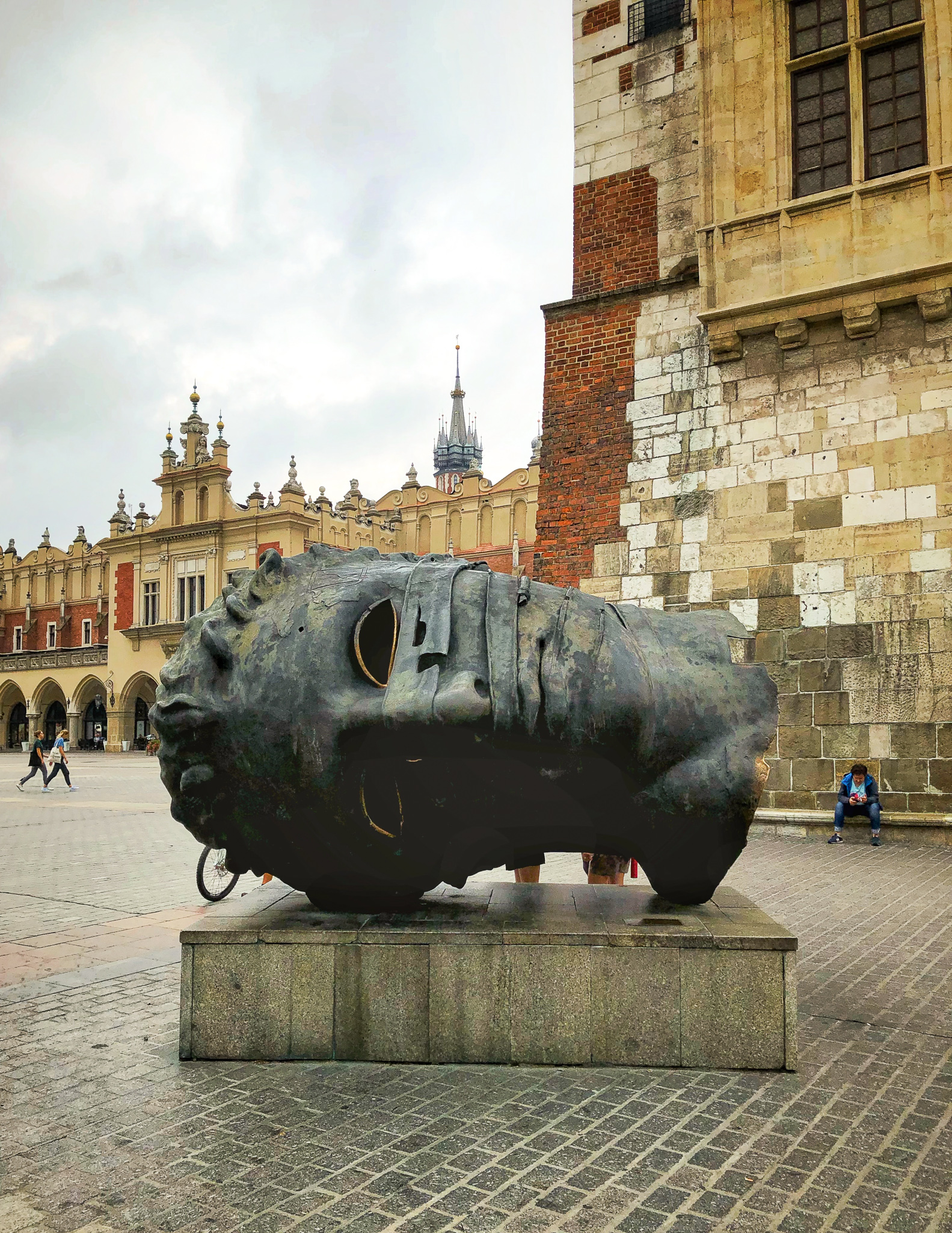 a giant mask statue in krakow a good city in poland for digital nomads to visit