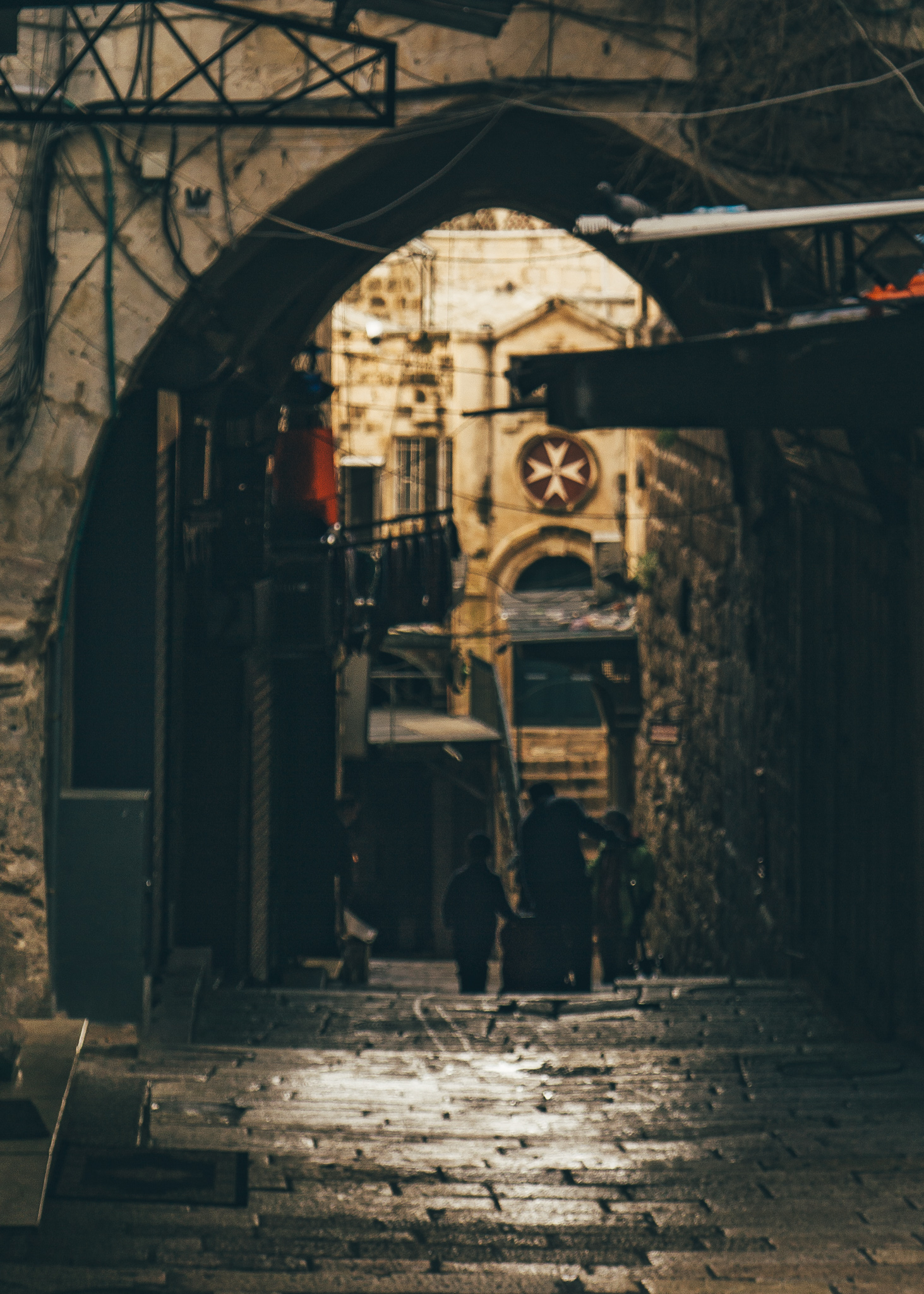 an arch over an alley in jerusalem
