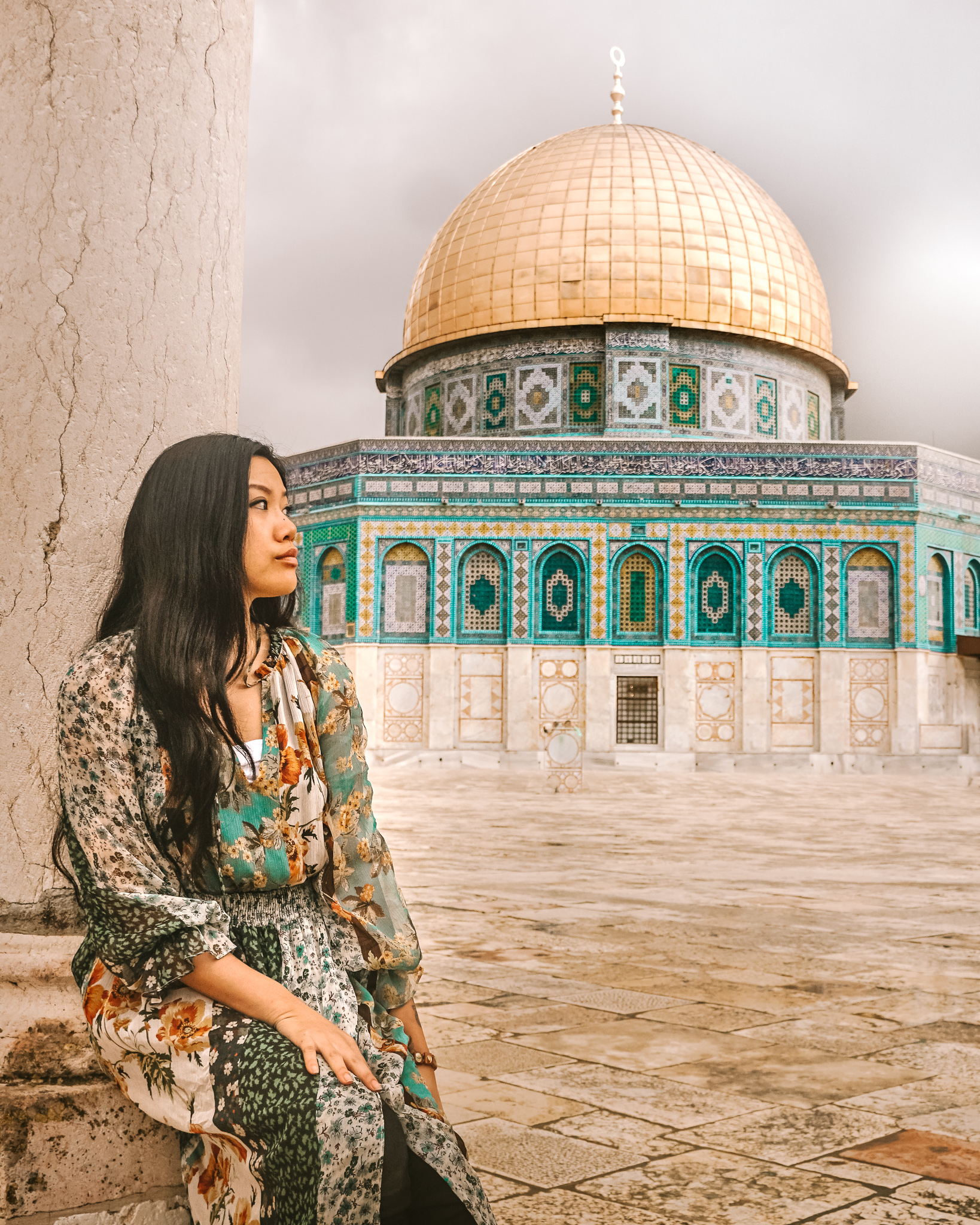 a girl in front of the Dome of the rock Mosque 