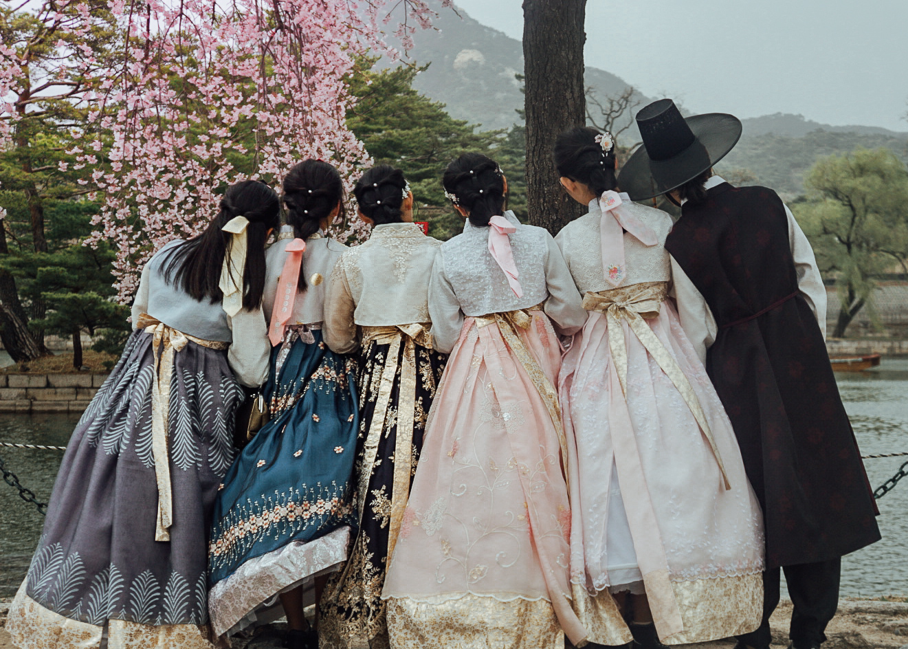 korean girls wearing hanbok during cherry blossom season in seoul
