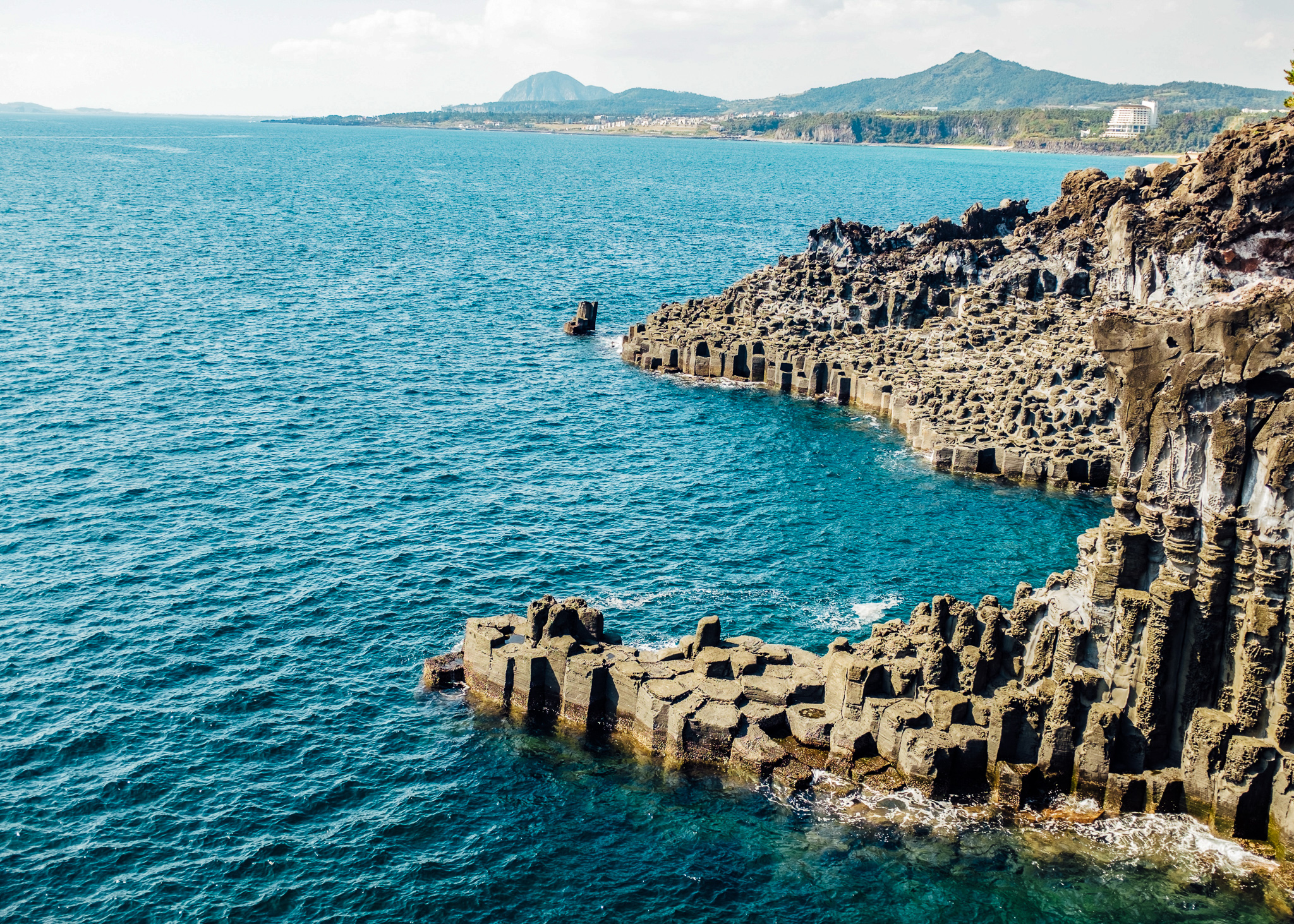 basaltic rock formations on the coast of jeju island
