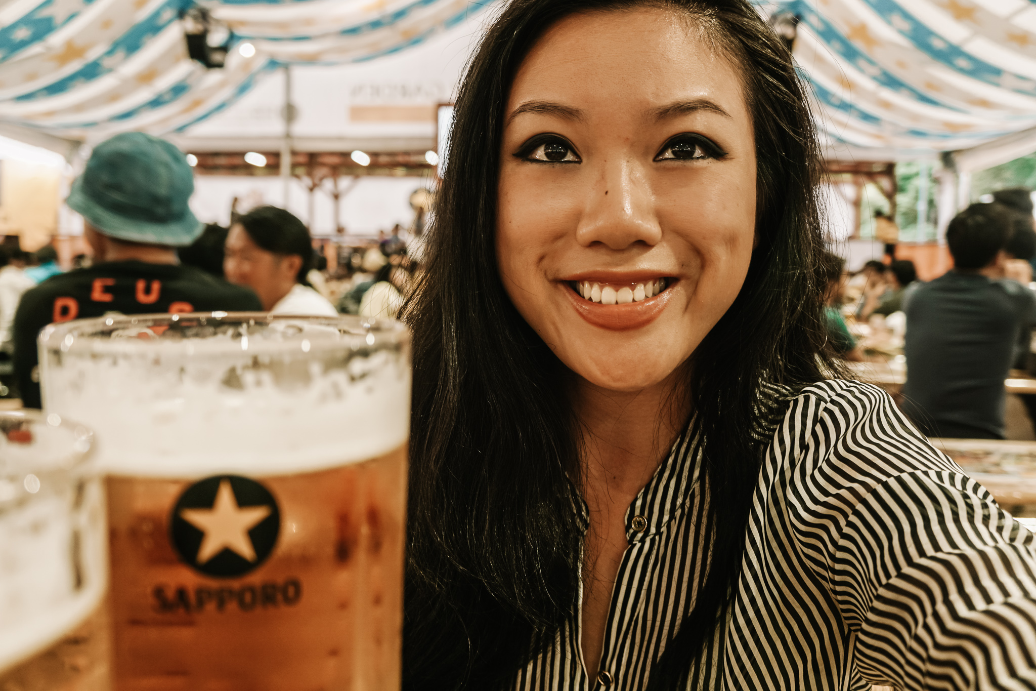a girl and a Sapporo beer in Sapporo Beer Garden in Hokkaido in summer