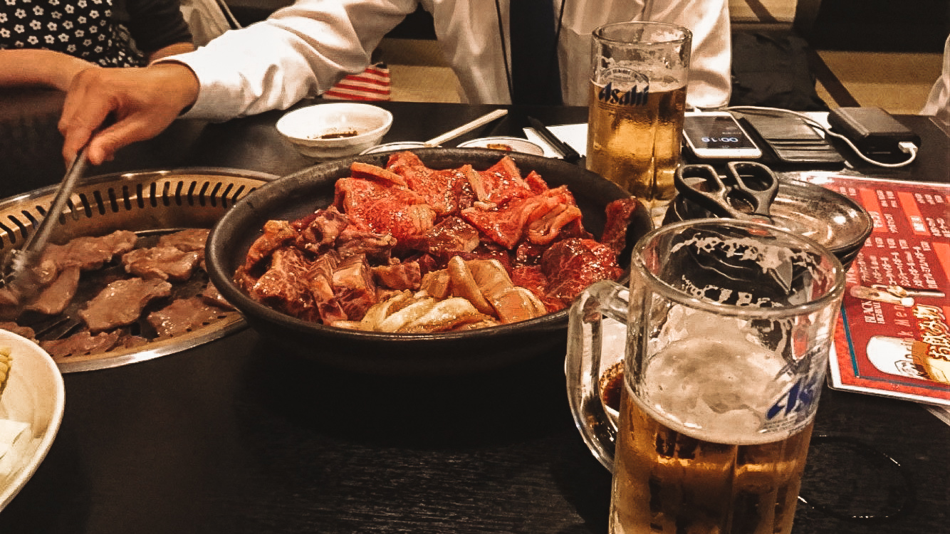A meat platter and beer in a barbecue restaurant in Hokkaido in summer