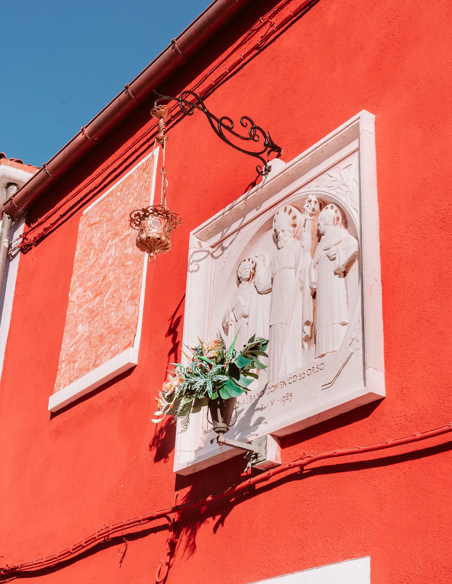 colorful building and wall sculpture in burano
