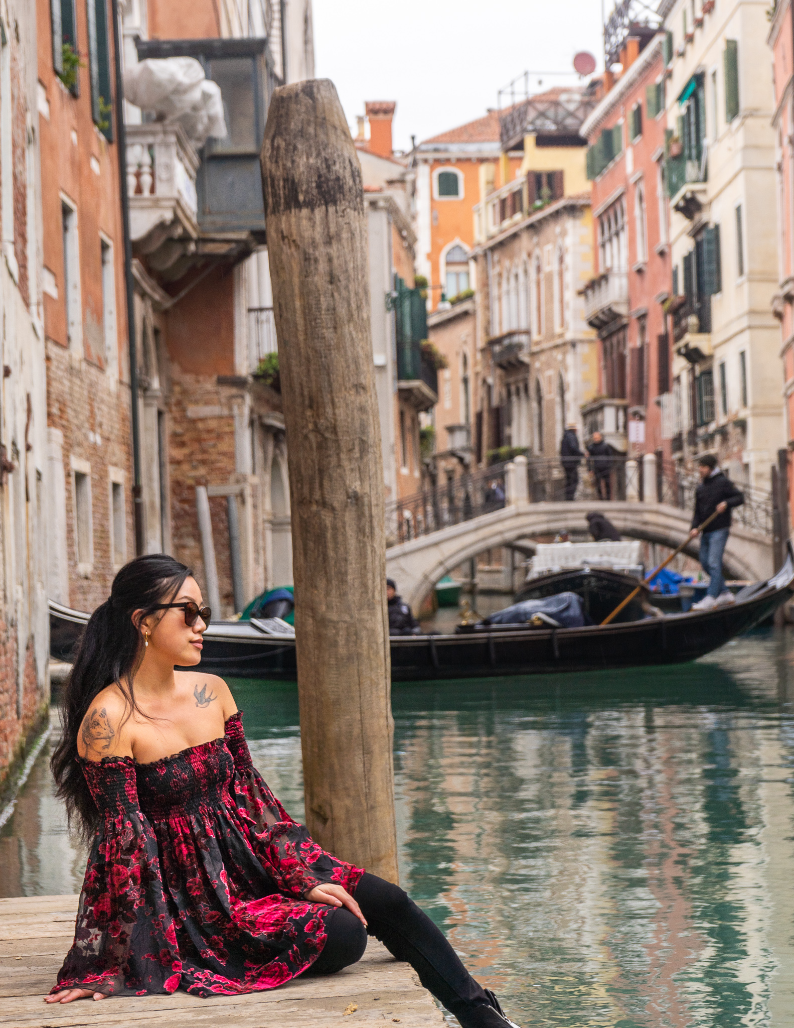 beautiful views from a canal in Venice with a gondola make Venice worth visiting
