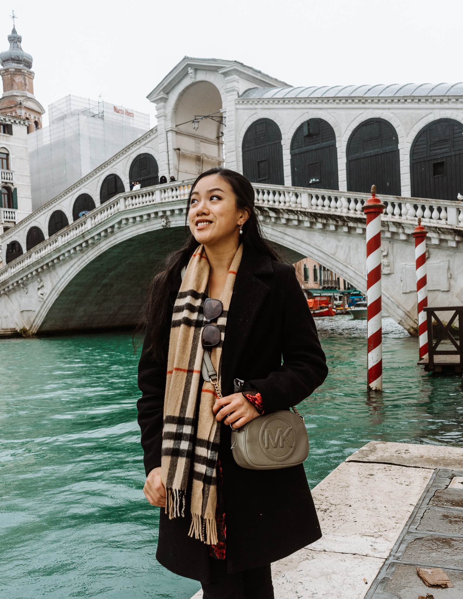girl in front of rialto bridge in Venice is fall