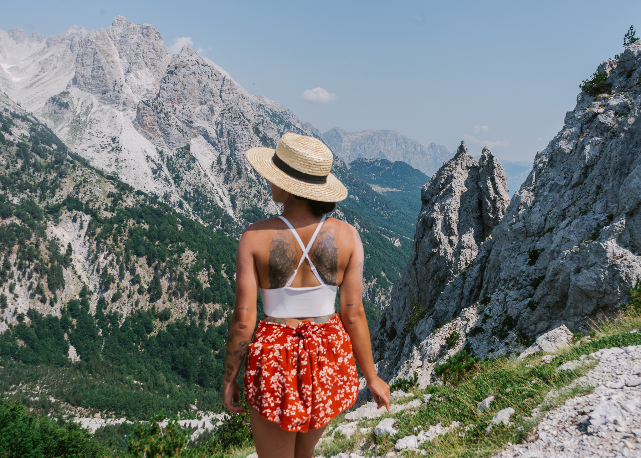 a girl overlooking Valbona Pass on the Theth to Valbona trail
