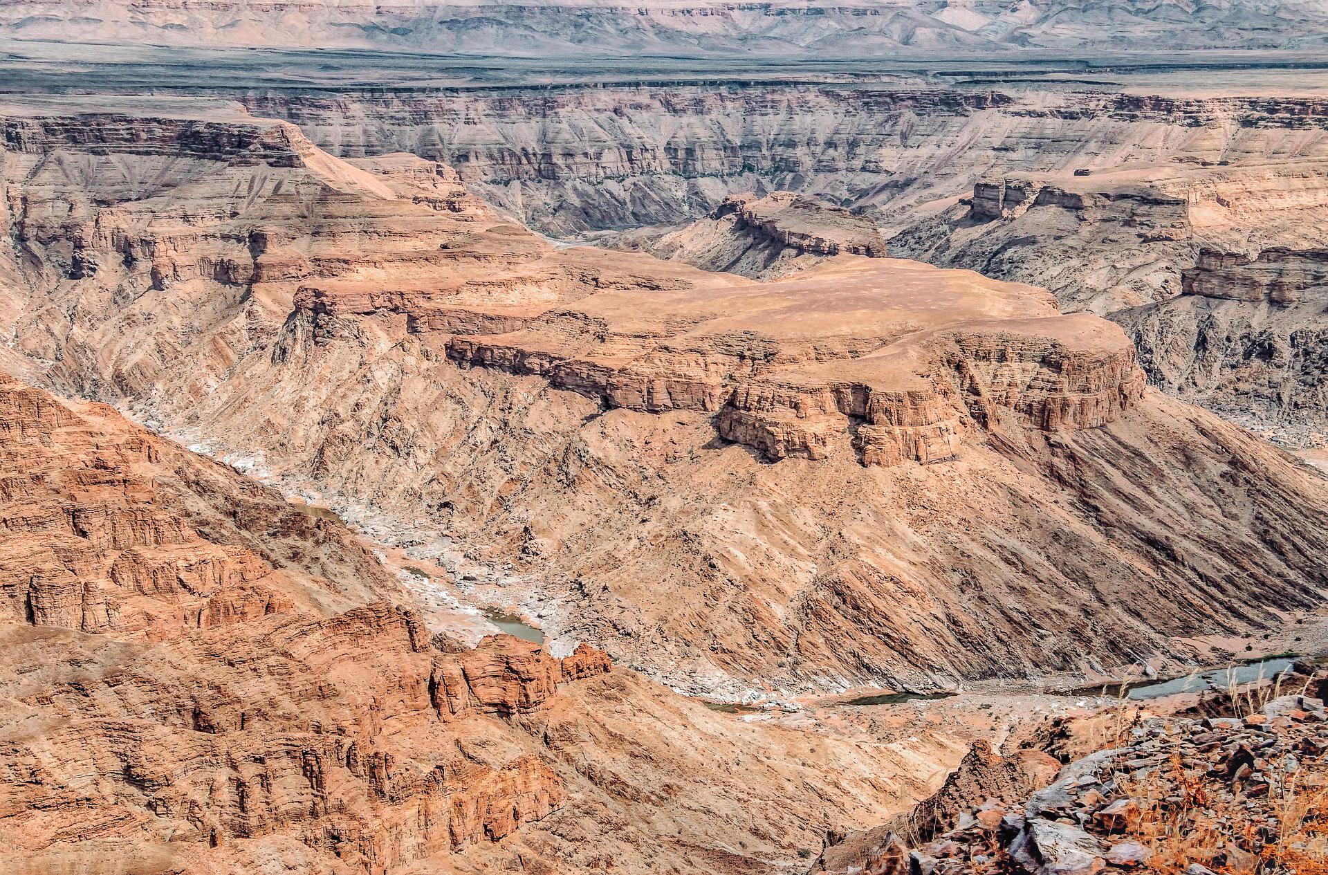looking down into fish hook canyon, a red canyon deeply carved by a river
