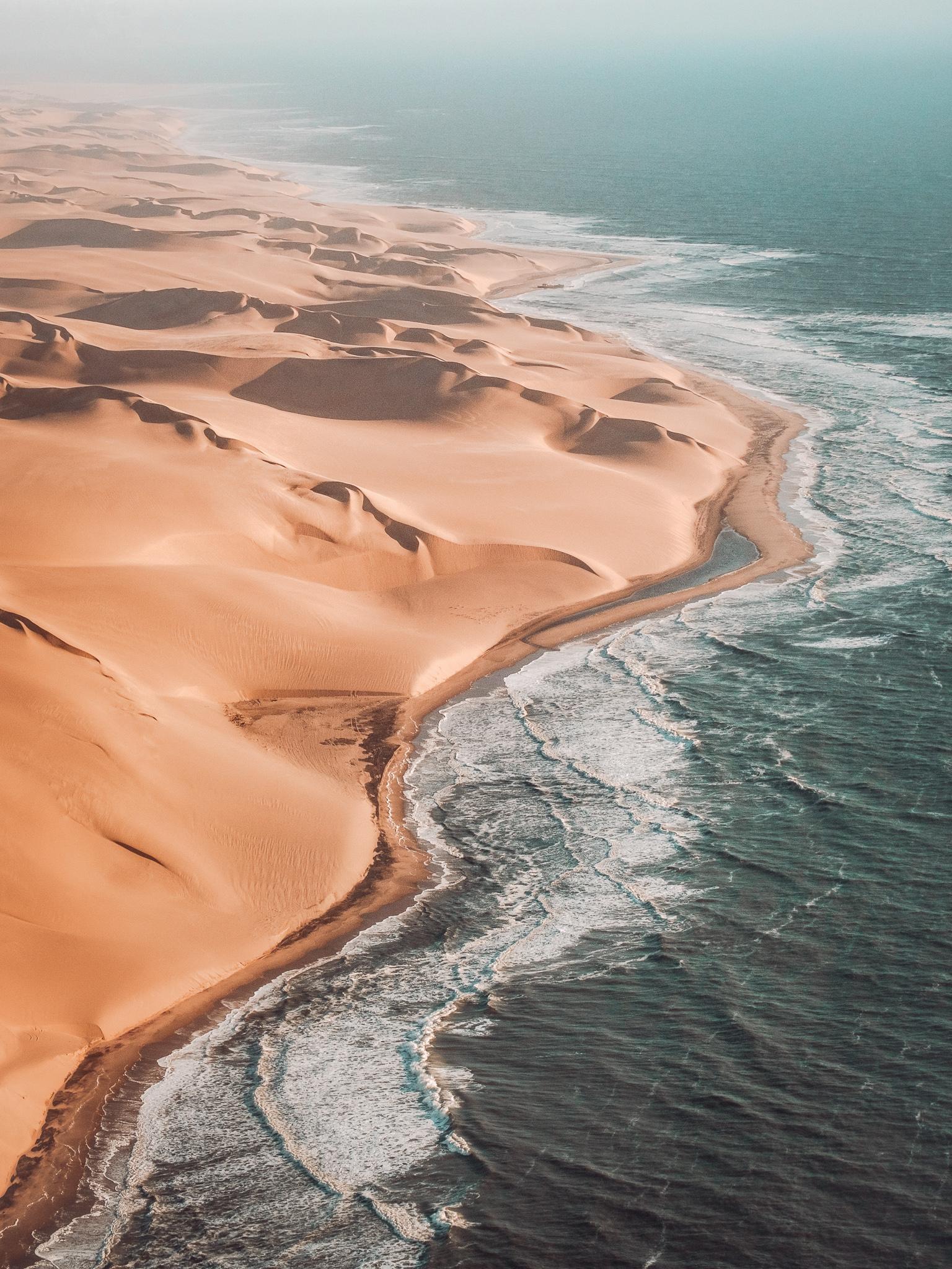 large sandy dunes touching the coastline