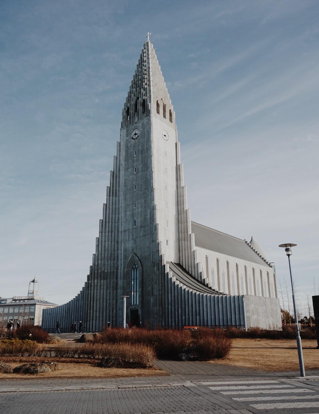 A very tall and grey church called Hallgrimskirkja church in Reykjavik Iceland
