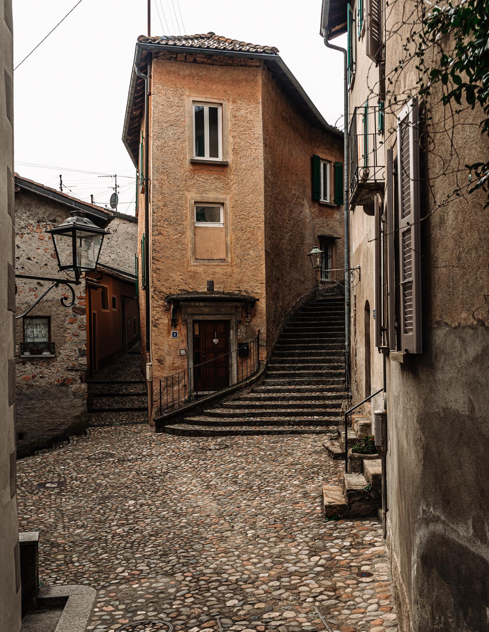 old cobbled alleyway and Italian style house in Morcote Ticino Switzerland