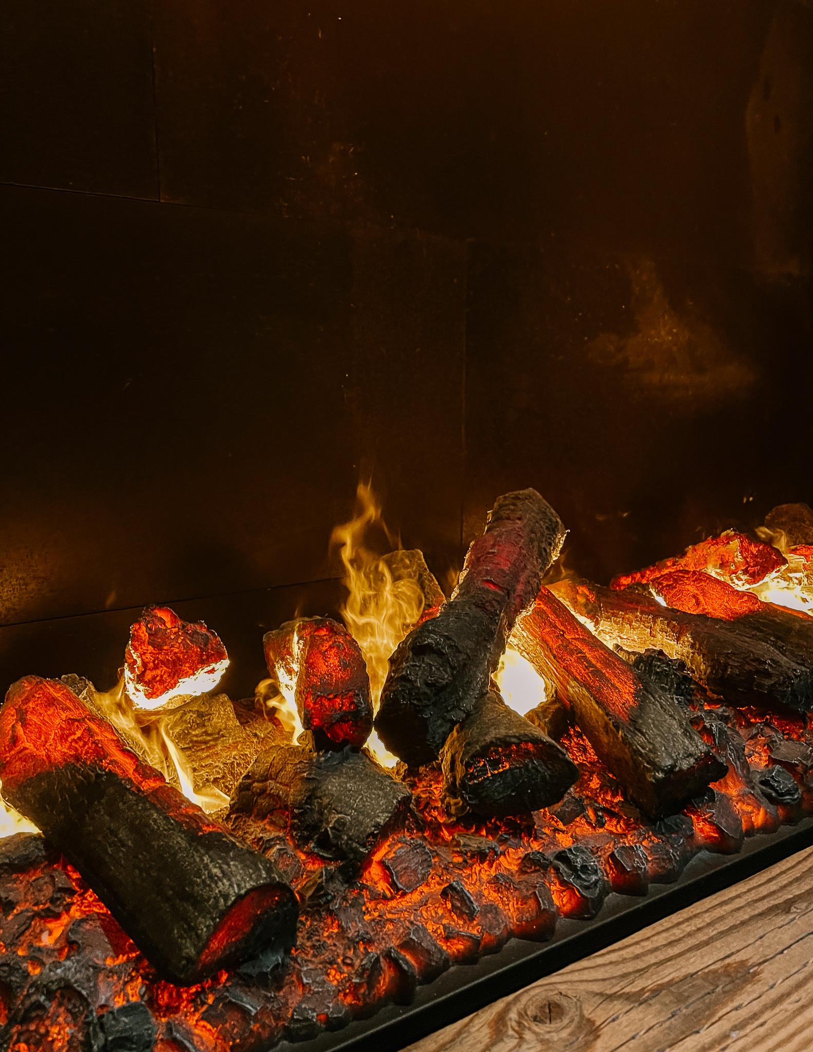 a crackling fire in a fireplace