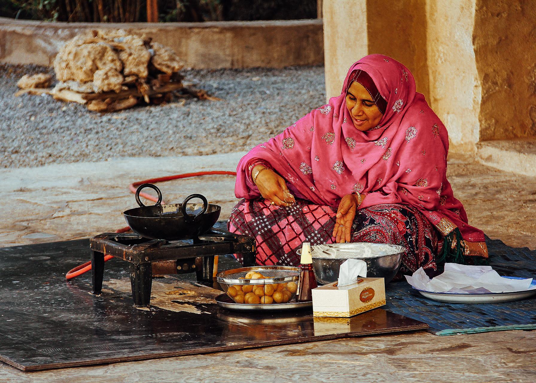 An Omani woman making Omani bread in Nizwa, Oman