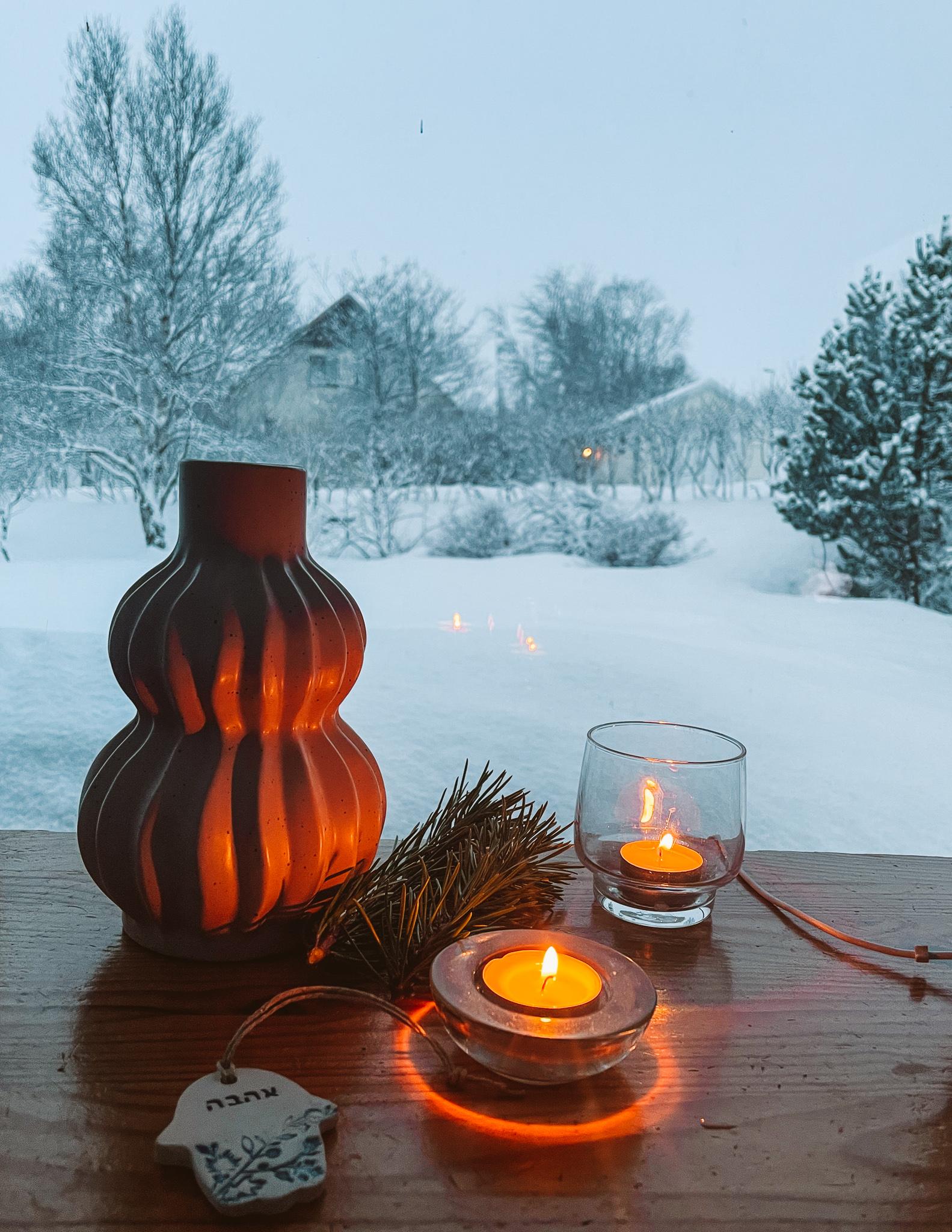 candles and a snowy landscape in Laugarvatn in winter