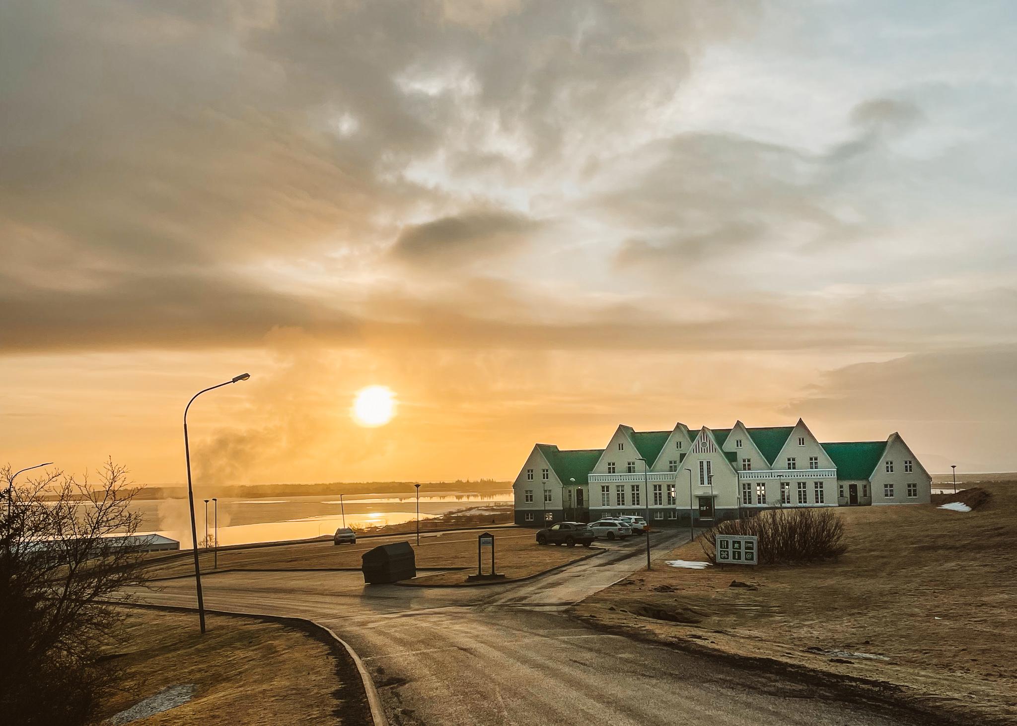 Herradsskolinn guesthouse during sunrise in front of Laugarvatn Lake in Iceland